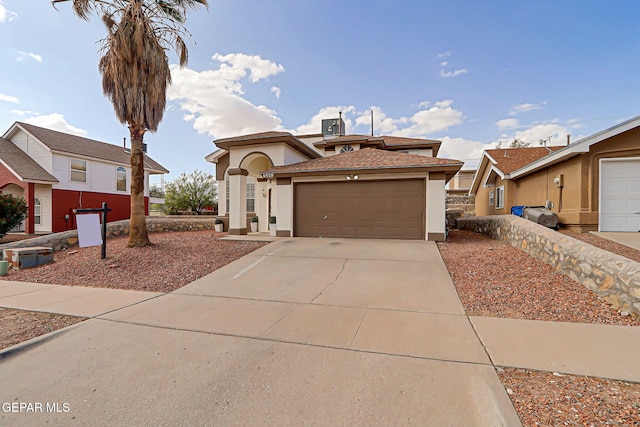 6929 Canyon View Ln, El Paso, TX 79912 - mediterranean / spanish-style house with stucco siding, a garage, and driveway