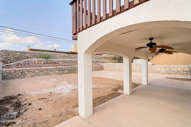 6929 Canyon View Ln, El Paso, TX 79912 - fenced backyard with a ceiling fan and a patio area