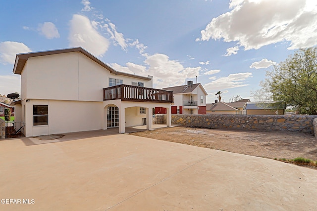 6929 Canyon View Ln, El Paso, TX 79912 - back of property with a balcony, a patio, and stucco siding