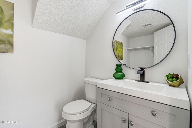 6929 Canyon View Ln, El Paso, TX 79912 - bathroom with a textured ceiling, vanity, and toilet