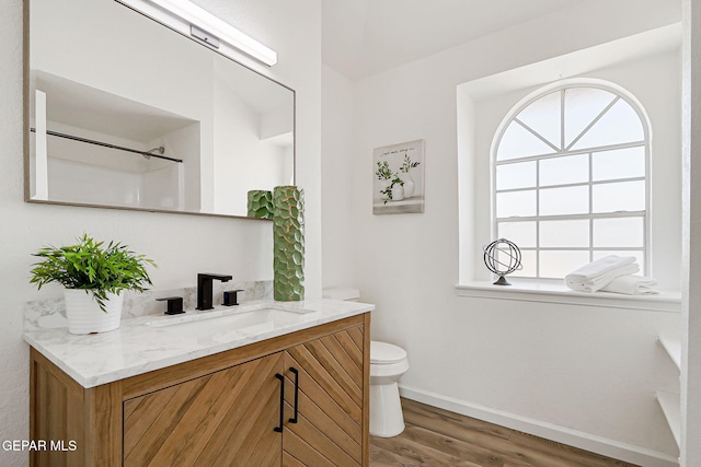 6929 Canyon View Ln, El Paso, TX 79912 - full bathroom featuring vanity, plenty of natural light, toilet, and baseboards