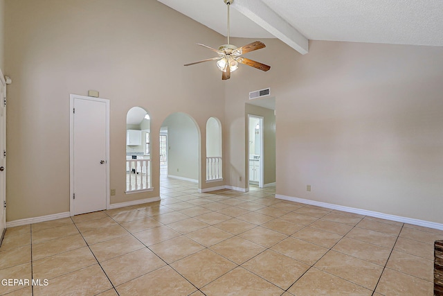 12013 Meadow Gate Dr, El Paso, TX 79936 - unfurnished room featuring a ceiling fan, beam ceiling, light tile patterned flooring, arched walkways, and high vaulted ceiling