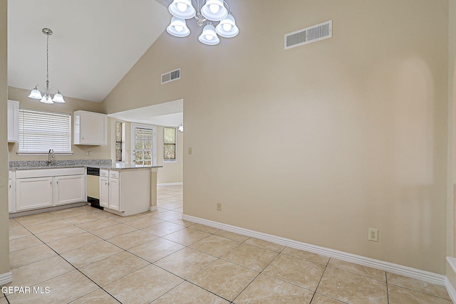 12013 Meadow Gate Dr, El Paso, TX 79936 - kitchen featuring a chandelier, a sink, dishwasher, white cabinets, and a peninsula