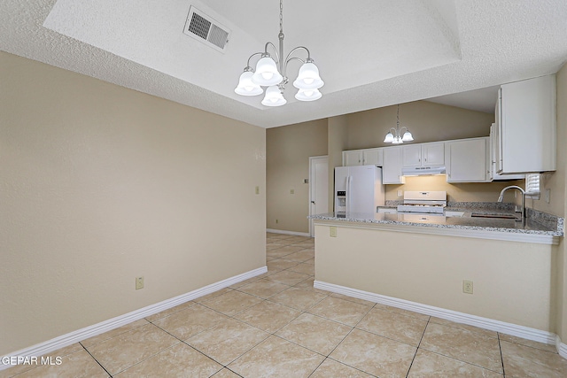 12013 Meadow Gate Dr, El Paso, TX 79936 - kitchen featuring white appliances, a chandelier, under cabinet range hood, a sink, and light stone countertops