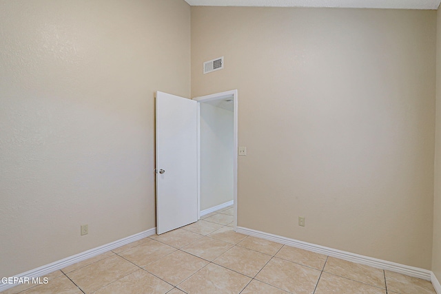12013 Meadow Gate Dr, El Paso, TX 79936 - spare room with light tile patterned flooring, baseboards, and a towering ceiling