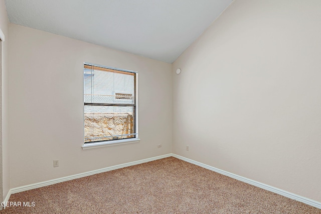 12013 Meadow Gate Dr, El Paso, TX 79936 - carpeted empty room featuring baseboards and lofted ceiling