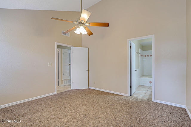 12013 Meadow Gate Dr, El Paso, TX 79936 - unfurnished bedroom featuring light colored carpet, high vaulted ceiling, baseboards, connected bathroom, and ceiling fan