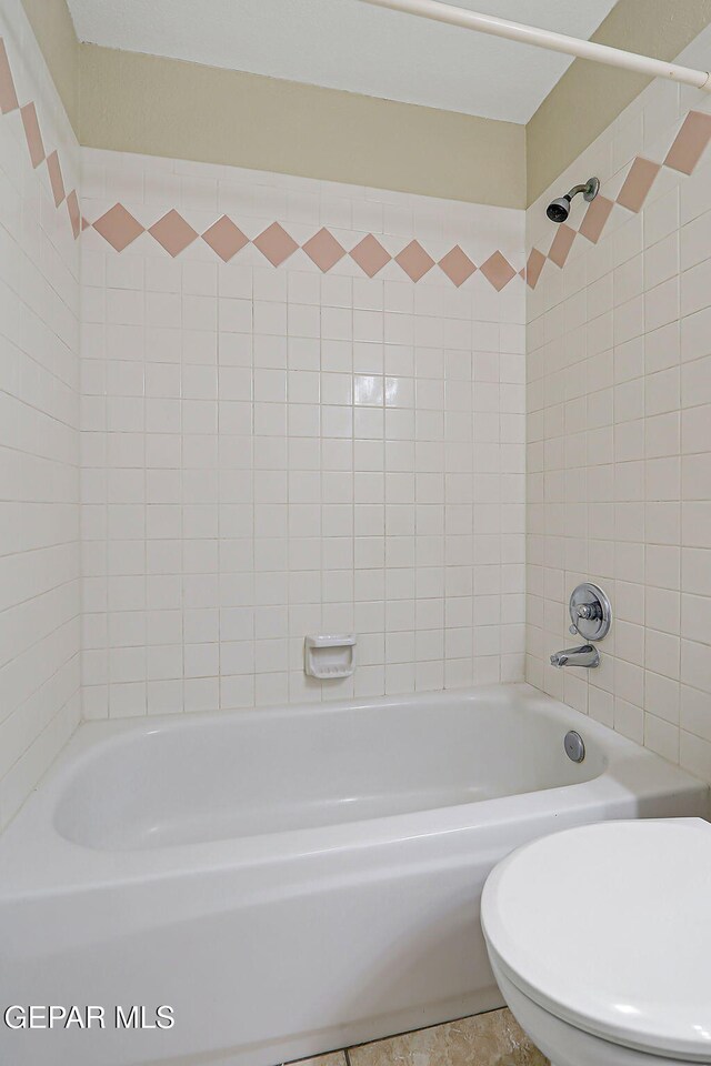 12013 Meadow Gate Dr, El Paso, TX 79936 - bathroom with bathing tub / shower combination and toilet