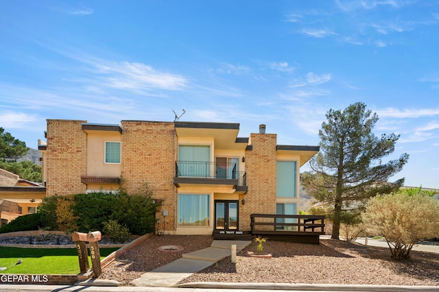 500 Tawny Oaks Pl, El Paso, TX 79912 - rear view of property featuring a balcony, french doors, brick siding, and stucco siding