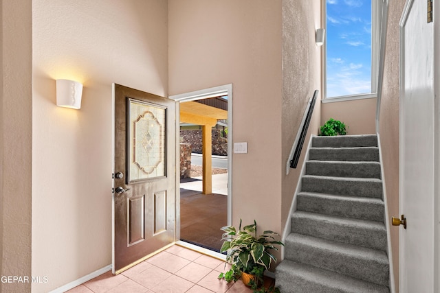 500 Tawny Oaks Pl, El Paso, TX 79912 - foyer featuring stairs, light tile patterned flooring, and baseboards