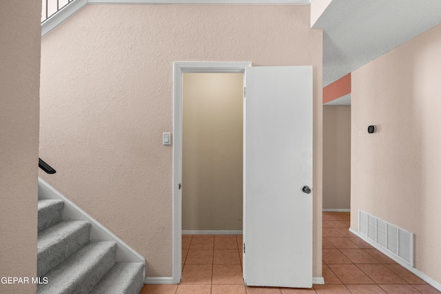 500 Tawny Oaks Pl, El Paso, TX 79912 - stairway featuring tile patterned floors, baseboards, and a textured wall