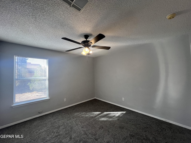 10256 Valle Suave Dr, El Paso, TX 79927 - unfurnished room with a ceiling fan, dark colored carpet, baseboards, and a textured ceiling