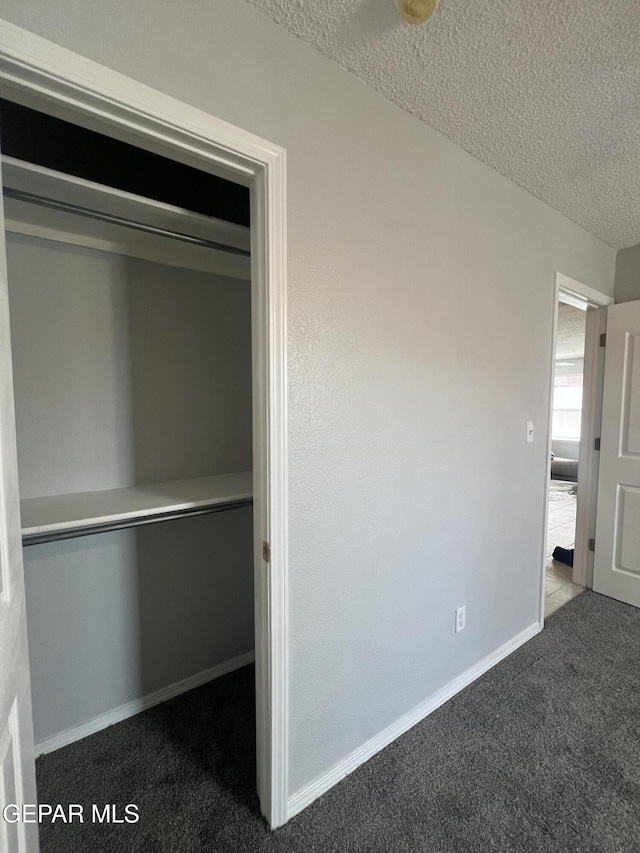 10256 Valle Suave Dr, El Paso, TX 79927 - unfurnished bedroom with carpet, a textured ceiling, and baseboards
