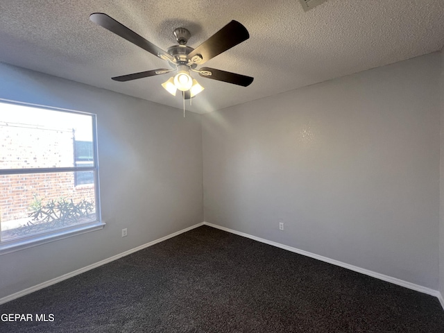 10256 Valle Suave Dr, El Paso, TX 79927 - empty room with dark carpet, a ceiling fan, a textured ceiling, and baseboards