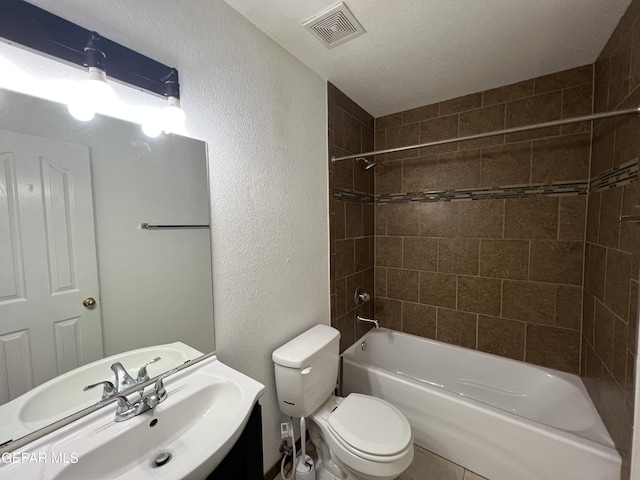 10256 Valle Suave Dr, El Paso, TX 79927 - full bath with toilet, shower / washtub combination, vanity, a textured wall, and tile patterned floors