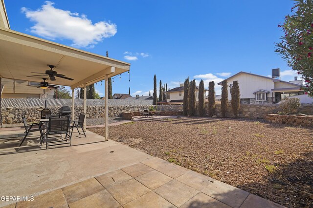 11457 David Carrasco Dr, El Paso, TX 79936 - fenced backyard featuring a ceiling fan, a patio, and outdoor dining space