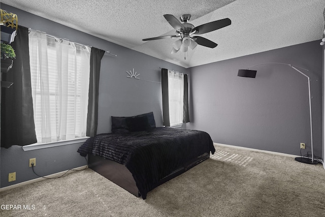11457 David Carrasco Dr, El Paso, TX 79936 - bedroom with carpet flooring, a textured ceiling, a ceiling fan, and baseboards