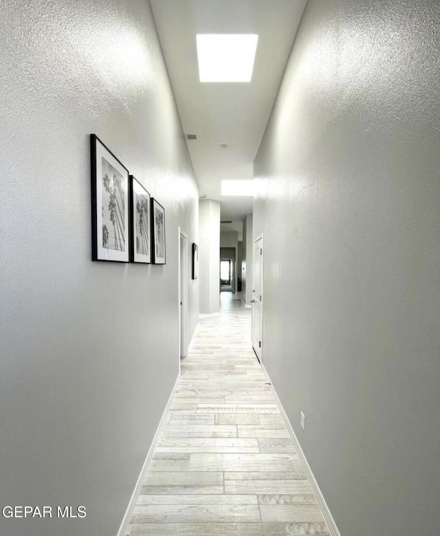 3920 Aspiration St, El Paso, TX 79938 - corridor with light wood finished floors and baseboards