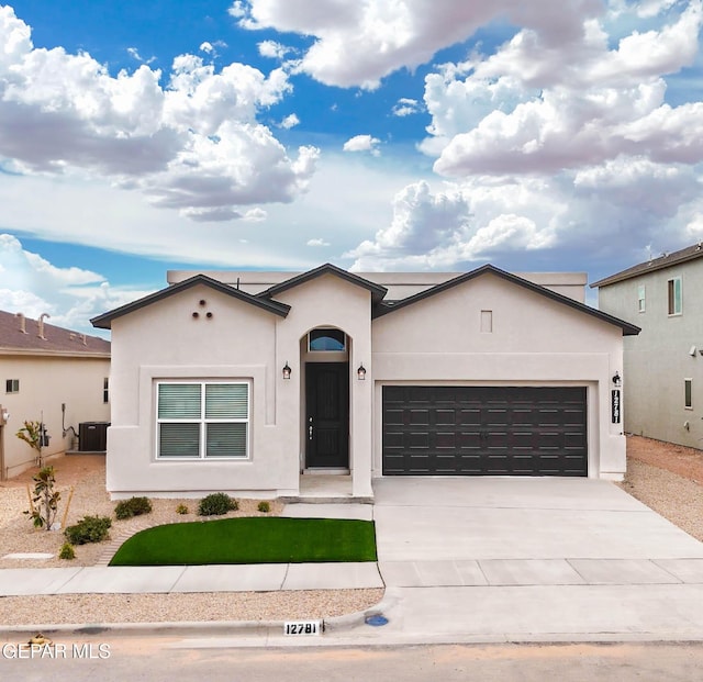 3920 Aspiration St, El Paso, TX 79938 - ranch-style house featuring a garage, driveway, stucco siding, and a front lawn
