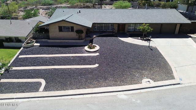 4313 Okeefe Dr, El Paso, TX 79902 - ranch-style home featuring a garage and driveway