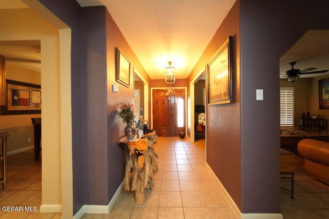 4313 Okeefe Dr, El Paso, TX 79902 - corridor featuring light tile patterned floors and a textured wall