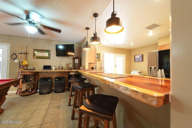 4313 Okeefe Dr, El Paso, TX 79902 - bar featuring ceiling fan, light tile patterned floors, decorative light fixtures, pool table, and vaulted ceiling