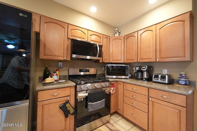 4313 Okeefe Dr, El Paso, TX 79902 - kitchen with appliances with stainless steel finishes, light tile patterned floors, and recessed lighting
