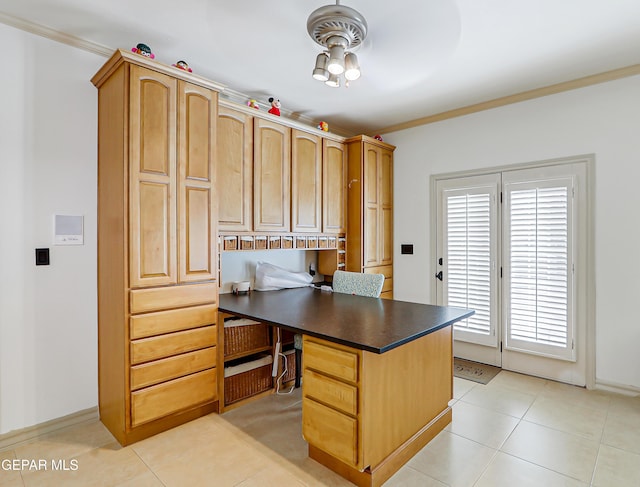 5500 Rancho Sereno Pl, El Paso, TX 79932 - office area featuring built in study area, a ceiling fan, crown molding, light tile patterned floors, and baseboards