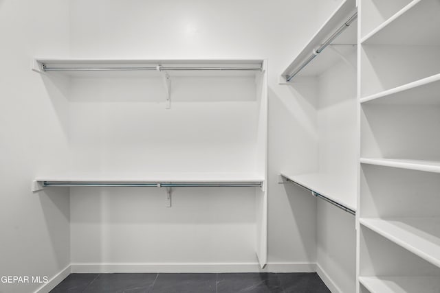 13380 Coldham St, El Paso, TX 79928 - spacious closet with dark tile patterned flooring