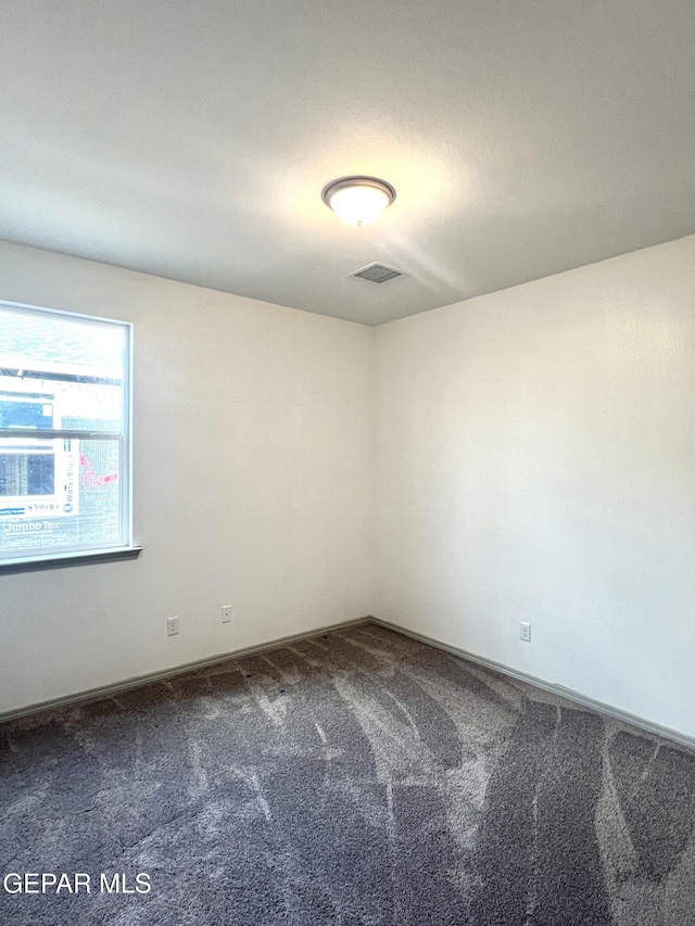 15221 Apex Ct, El Paso, TX 79938 - unfurnished room featuring dark carpet and baseboards