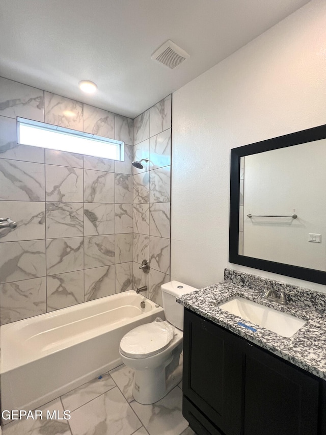 15221 Apex Ct, El Paso, TX 79938 - full bath with vanity, marble look tiles, washtub / shower combination, and toilet