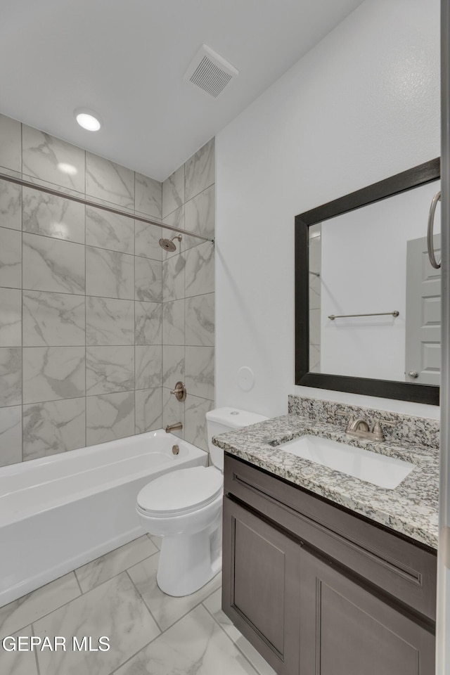 15221 Apex Ct, El Paso, TX 79938 - bathroom with marble look tile flooring, vanity, and washtub / shower combination