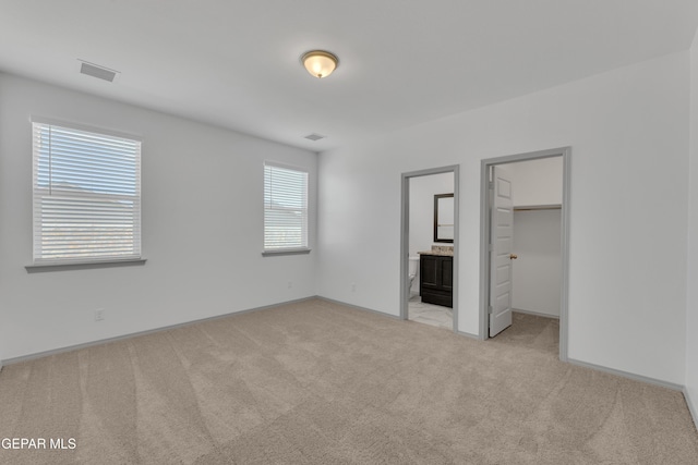15221 Apex Ct, El Paso, TX 79938 - unfurnished bedroom with carpet flooring, a walk in closet, and connected bathroom
