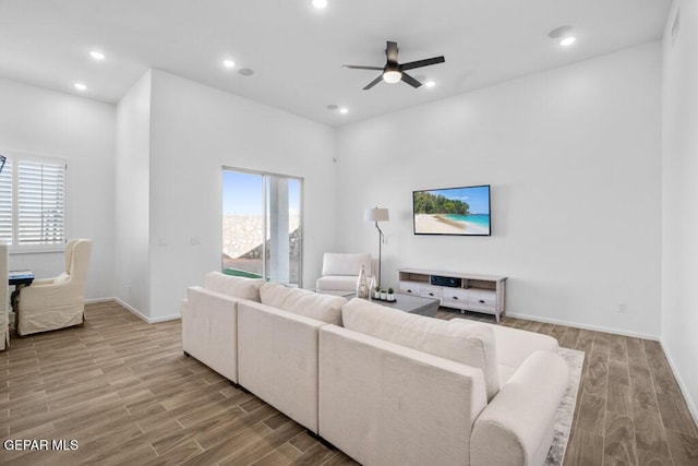 891 Dewsbury Way, El Paso, TX 79928 - living area featuring healthy amount of natural light, wood finished floors, ceiling fan, recessed lighting, and baseboards