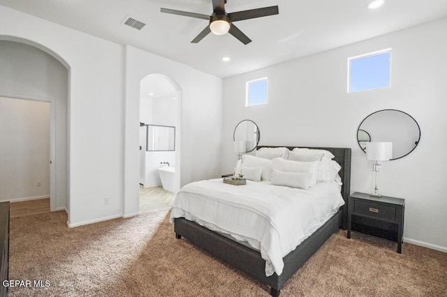 891 Dewsbury Way, El Paso, TX 79928 - bedroom featuring arched walkways, carpet flooring, recessed lighting, baseboards, and connected bathroom