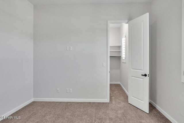 899 Dewsbury Way, El Paso, TX 79928 - unfurnished bedroom featuring carpet flooring, a spacious closet, baseboards, and a closet