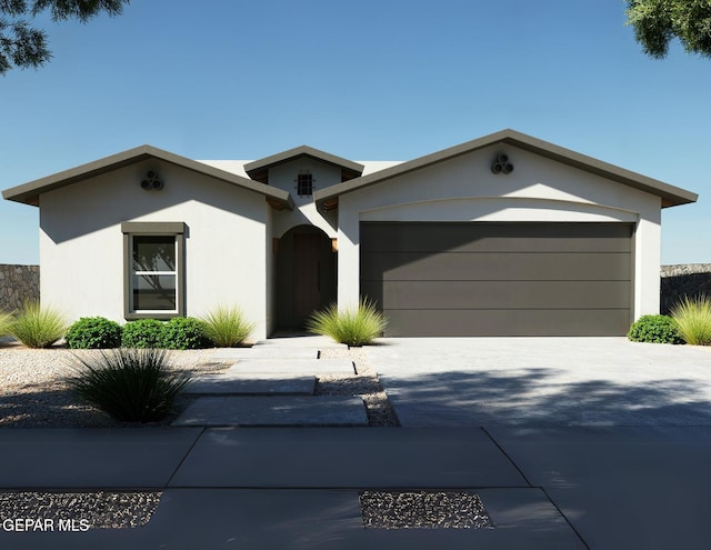 953 Ada Ln, El Paso, TX 79932 - ranch-style home with stucco siding, an attached garage, and driveway