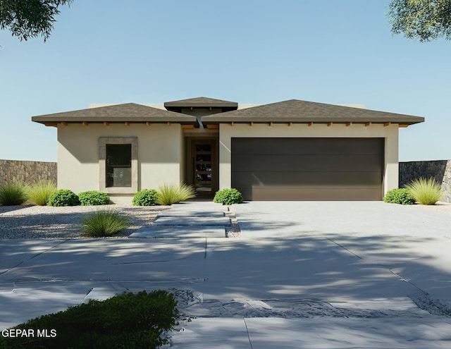 953 Ada Ln, El Paso, TX 79932 - prairie-style house with an attached garage, driveway, and stucco siding