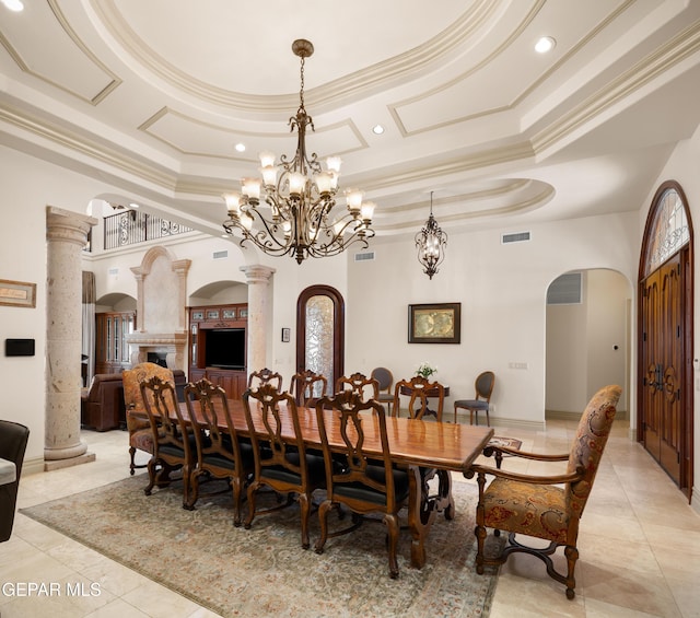 6572 Tuscany Ridge Dr, El Paso, TX 79912 - dining space with arched walkways, a raised ceiling, crown molding, recessed lighting, and light tile patterned flooring