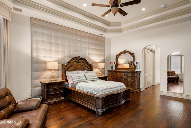 6572 Tuscany Ridge Dr, El Paso, TX 79912 - bedroom with hardwood / wood-style flooring, arched walkways, ornamental molding, a tray ceiling, and recessed lighting