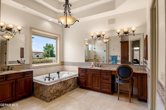6572 Tuscany Ridge Dr, El Paso, TX 79912 - bathroom featuring a chandelier, a garden tub, two vanities, a stall shower, and tile patterned flooring