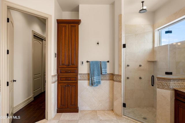 6572 Tuscany Ridge Dr, El Paso, TX 79912 - full bathroom featuring a shower stall, vanity, and wood finished floors