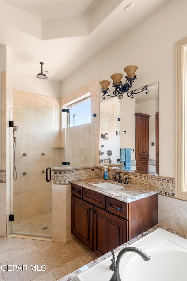 6572 Tuscany Ridge Dr, El Paso, TX 79912 - full bathroom with a stall shower, vanity, a tub to relax in, and a chandelier