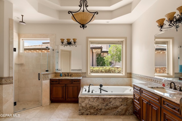 6572 Tuscany Ridge Dr, El Paso, TX 79912 - full bath featuring a shower stall, a raised ceiling, two vanities, a whirlpool tub, and tile patterned floors