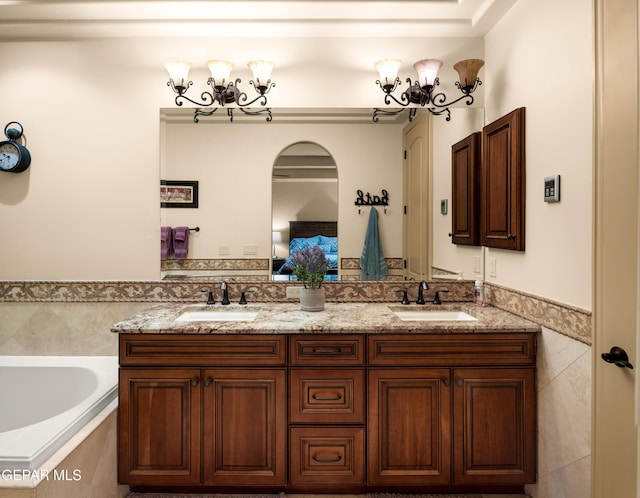 6572 Tuscany Ridge Dr, El Paso, TX 79912 - ensuite bathroom with double vanity and a bath
