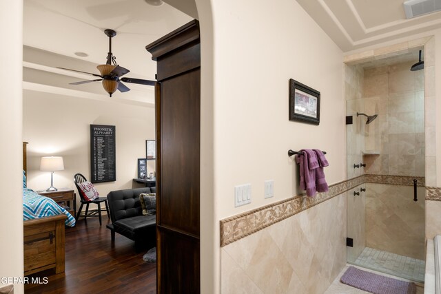 6572 Tuscany Ridge Dr, El Paso, TX 79912 - corridor featuring dark wood finished floors, tile walls, and a wainscoted wall