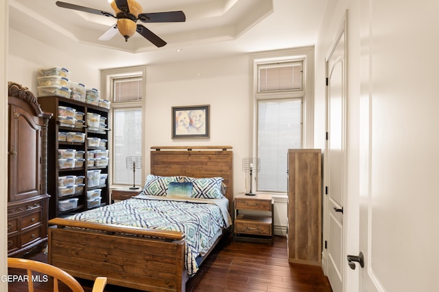 6572 Tuscany Ridge Dr, El Paso, TX 79912 - bedroom with hardwood / wood-style floors, a tray ceiling, and a ceiling fan