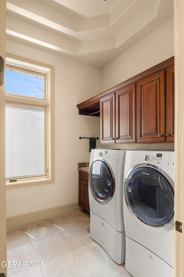 6572 Tuscany Ridge Dr, El Paso, TX 79912 - washroom featuring washing machine and clothes dryer and cabinet space