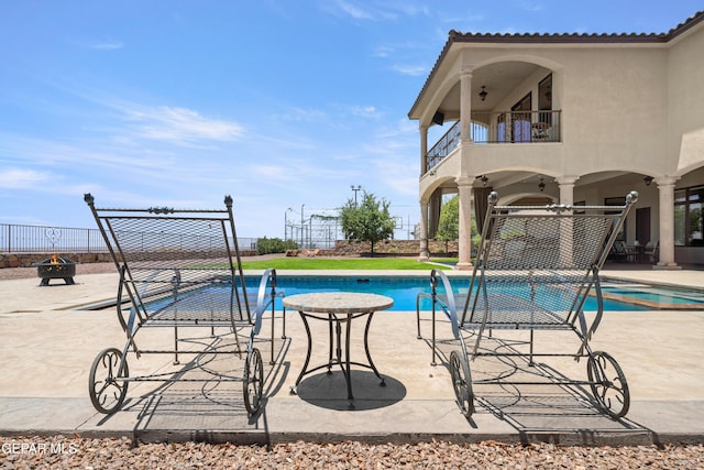 6572 Tuscany Ridge Dr, El Paso, TX 79912 - view of pool featuring a patio and a fire pit