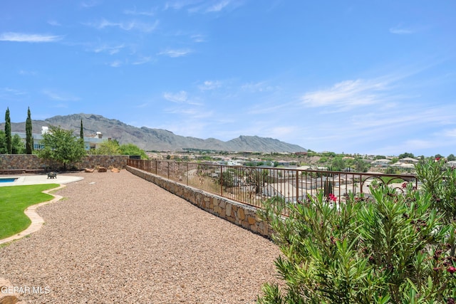 6572 Tuscany Ridge Dr, El Paso, TX 79912 - fenced backyard featuring a mountain view and a patio